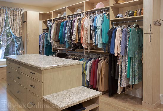 Master Closet with with Closet Island and Shoe Storage
