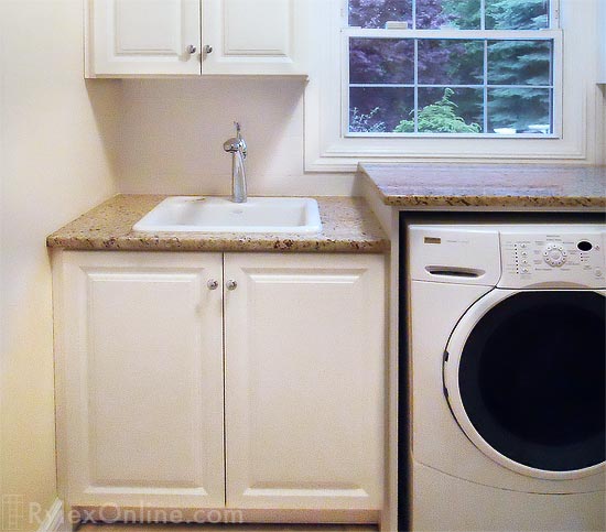Laundry Room Folding Counter and Storage Cabinets